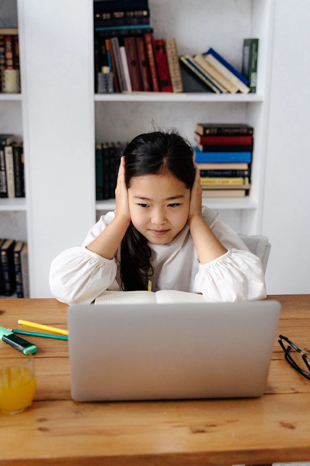 Child working on a learning activity with support from an educator