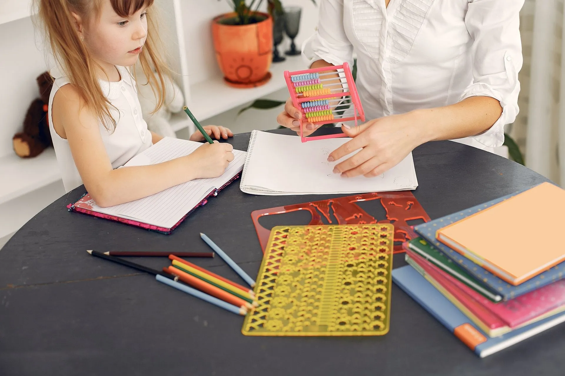 A specialist working through a learning activity with a child